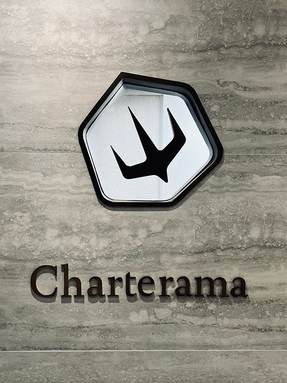 Charterama Office Renovation with tile, wood louvers and stainless steel signage