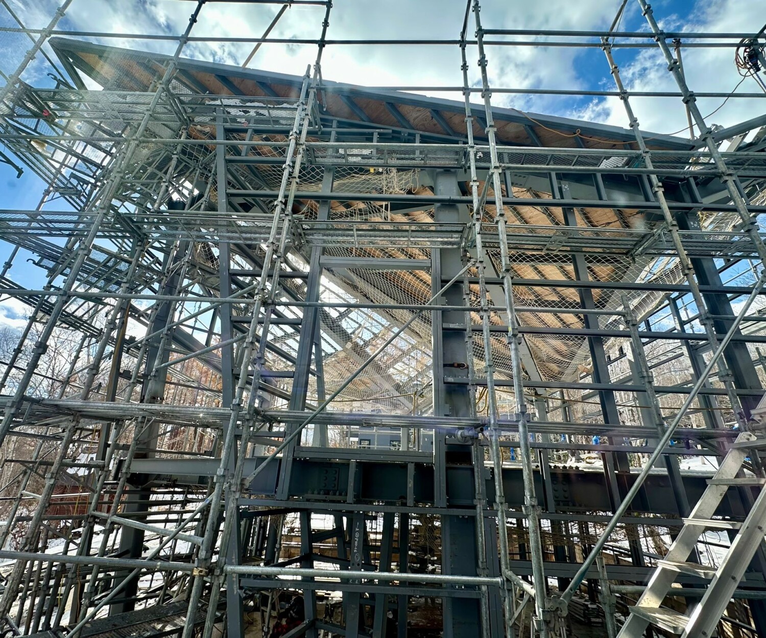 scafollding and framing of a steel frame post and beam house construction site with a triangular roof in Niseko, Kutchan Hokkaido Japan